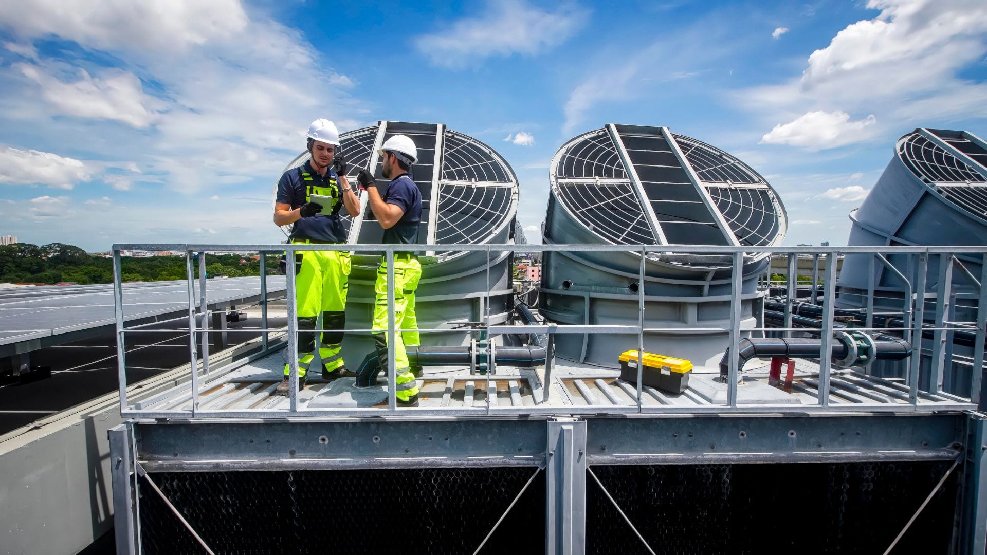 Advantage Heating & Air Conditioning technicians servicing rooftop equipment in Oklahoma City