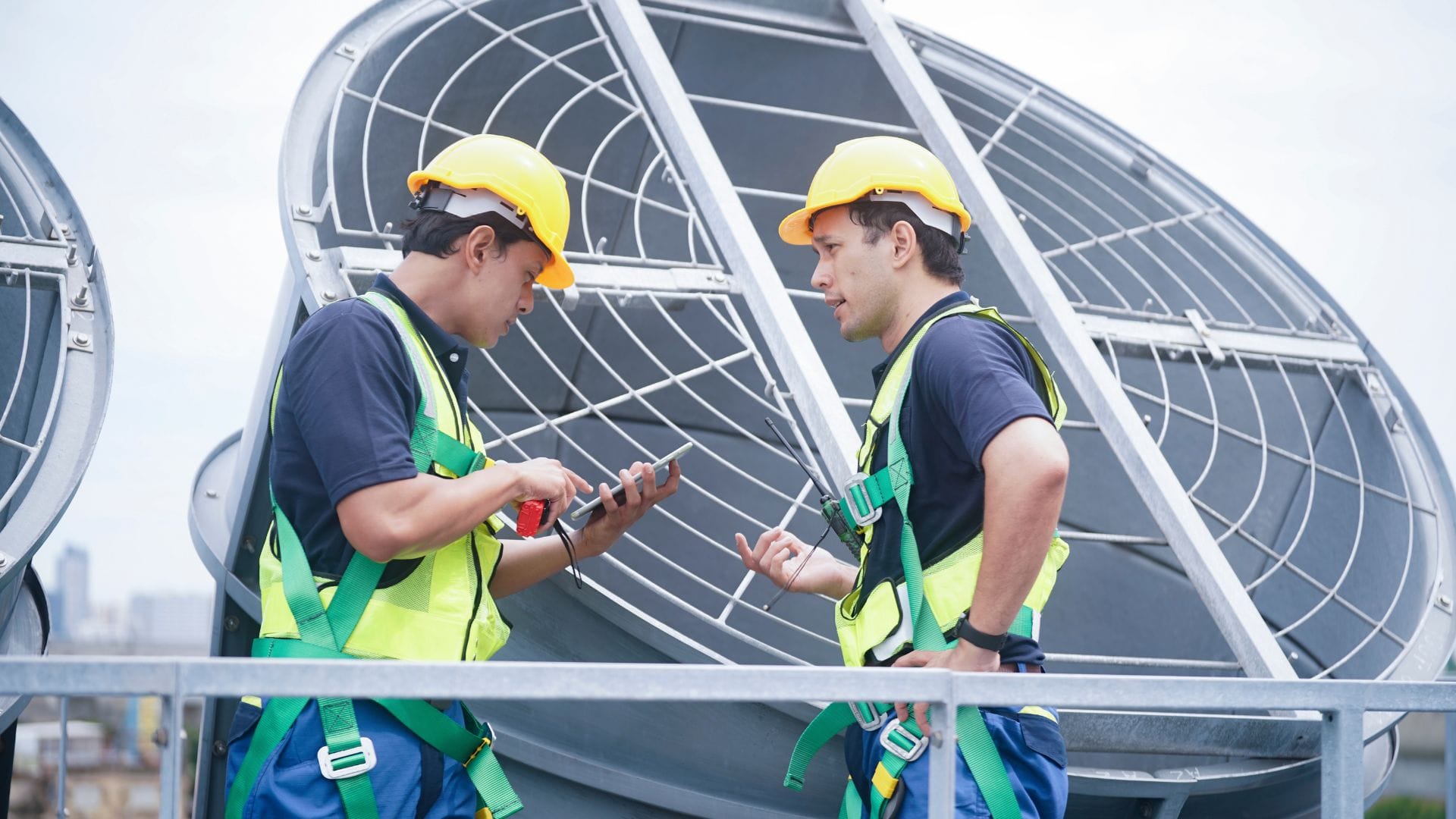 Commercial HVAC technicians servicing a rooftop unit
