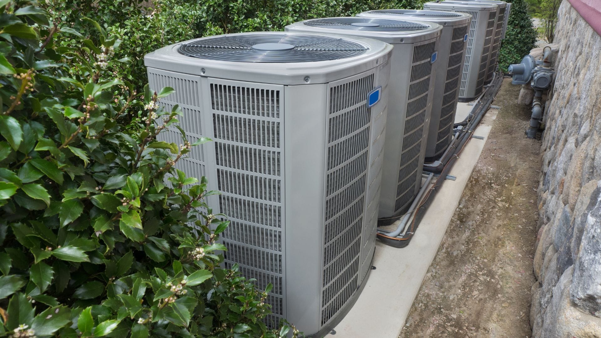 Multiple residential AC condensers installed by Advantage Heating & Air