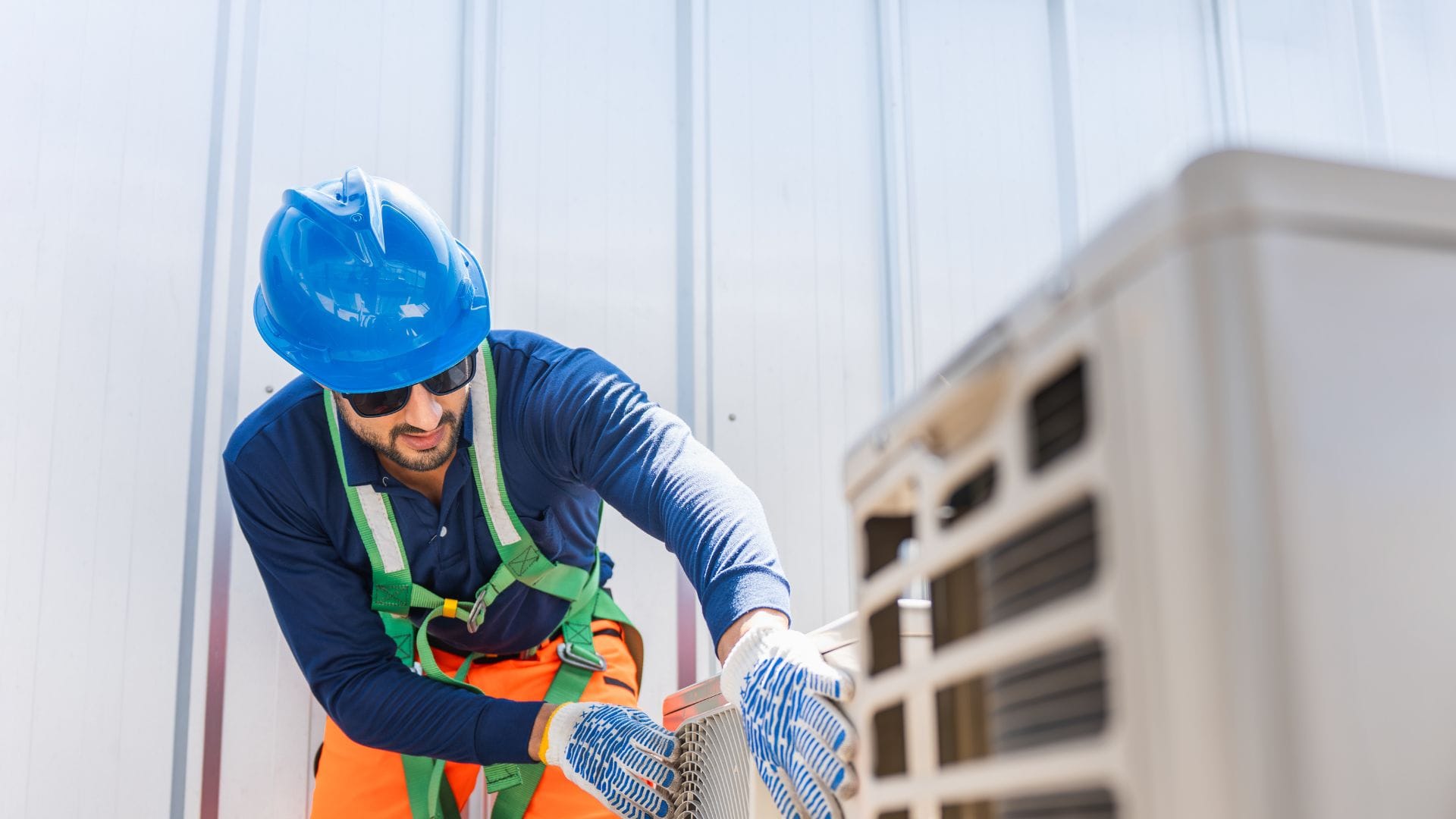 Commercial HVAC technician on a rooftop install